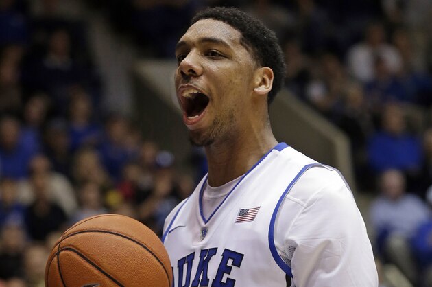 Duke's Jahlil Okafor (15) reacts following a dunk against Army during the second half of an NCAA college basketball game in Durham, N.C., Sunday, Nov. 30, 2014. Duke won 93-73. (AP Photo/Gerry Broome)