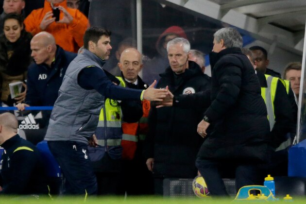 Chelsea's head coach Jose Mourinho, right, and Tottenham Hotspur's head coach Mauricio Pochettino shake hands at the final whistle of the English Premier League soccer match between Chelsea and Tottenham Hotspur at Stamford Bridge stadium in London, Wednesday, Dec. 3, 2014.  (AP Photo/Matt Dunham)