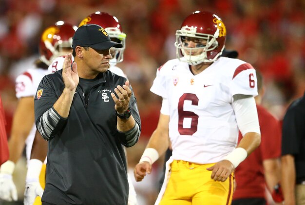 Oct 11, 2014; Tucson, AZ, USA; Southern California Trojans head coach Steve Sarkisian (left) and quarterback Cody Kessler (6) prior to the game against the Arizona Wildcats at Arizona Stadium. Mandatory Credit: Mark J. Rebilas-USA TODAY Sports