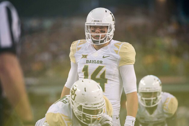 Nov 29, 2014; Arlington, TX, USA; Baylor Bears quarterback Bryce Petty (14) during the game against the Texas Tech Red Raiders at AT&T Stadium. The Bears defeated the Red Raiders 48-46. Mandatory Credit: Jerome Miron-USA TODAY Sports