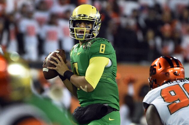 CORVALLIS, OR - NOVEMBER 29: Quarterback Marcus Mariota #8 of the Oregon Ducks passes the ball during the fourth quarter of the game against the Oregon State Beavers at Reser Stadium on November 29, 2014 in Corvallis, Oregon. (Photo by Steve Dykes/Getty Images)