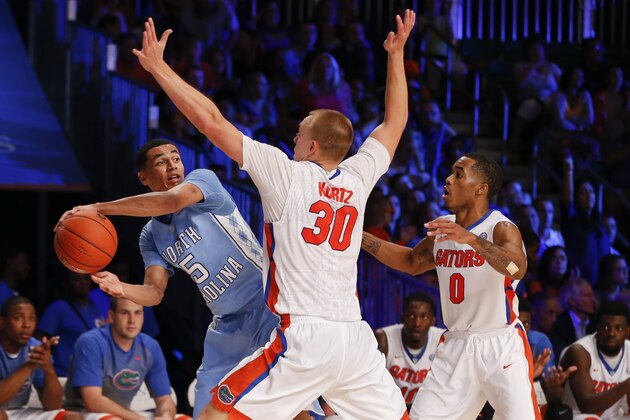 Nov 28, 2014; Paradise Island, BAHAMAS; North Carolina Tar Heels guard Marcus Paige (5) passes around Florida Gators forward Jacob Kurtz (30) during the game at Imperial Arena at Atlantis Resort. Mandatory Credit: Kevin Jairaj-USA TODAY Sports