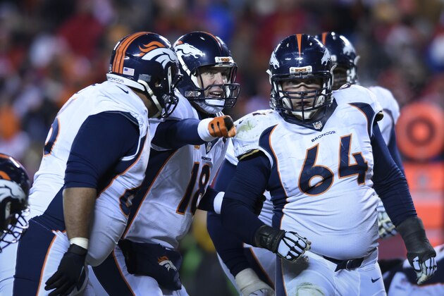 Denver Broncos quarterback Peyton Manning (18) gives instructions to Will Montgomery (64)  Manny Ramirez (66)  during their NFL football game in Kansas City, Mo., Sunday, Nov. 30, 2014. (AP Photo/Reed Hoffmann)