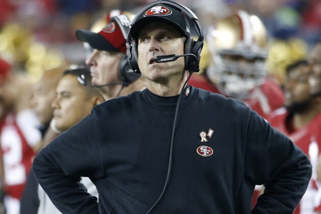 San Francisco 49ers head coach Jim Harbaugh stands on the sideline during the fourth quarter of an NFL football game against the Seattle Seahawks in Santa Clara, Calif., Thursday, Nov. 27, 2014. The Seahawks won 19-3. (AP Photo/Tony Avelar)