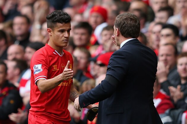 LIVERPOOL, ENGLAND - APRIL 13:  Liverpool Manager Brendan Rodgers congratulates Philippe Coutinho as he is substituted during the Barclays Premier League match between Liverpool and Manchester City at Anfield on April 13, 2014 in Liverpool, England.  (Photo by Alex Livesey/Getty Images)