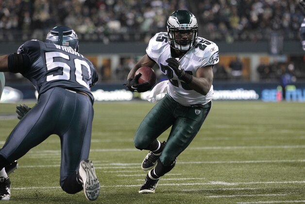 Philadelphia Eagles running back LeSean McCoy, left, breaks past Seattle Seahawks linebacker K.J. Wright on McCoy's way to scoring a touchdown in the first half of an NFL football game, Thursday, Dec. 1, 2011, in Seattle. (AP Photo/Elaine Thompson)