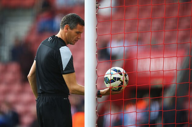 SOUTHAMPTON, ENGLAND - OCTOBER 18:  Referee Andre Marriner checks the goal line technology system prior to the Barclays Premier League match between Southampton and Sunderland at St Mary's Stadium on October 18, 2014 in Southampton, England.  (Photo by Richard Heathcote/Getty Images)