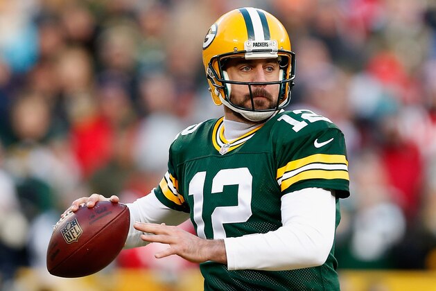 GREEN BAY, WI - NOVEMBER 30:  Quarterback Aaron Rodgers #12 of the Green Bay Packers dops back to pass during the NFL game against the New England Patriots at Lambeau Field on November 30, 2014 in Green Bay, Wisconsin. The Packers defeated the Patriots 26-21.  (Photo by Christian Petersen/Getty Images)