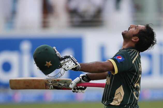 Pakistani batsman Sarfraz Ahmed celebrates after he scored half a century during the second one day international match between Australia and Pakistan in Dubai, United Arab Emirates, Friday, Oct. 10, 2014. (AP Photo/Kamran Jebreili)