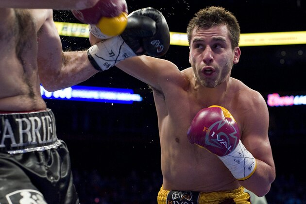 David Lemieux, right, from Laval, Que., trades blows with Marco Antonio Rubio during their WBC middleweight elimination fight in Montreal, Friday, April 8, 2011.The CANADIAN PRESS/Graham Hughes