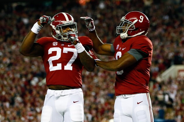 TUSCALOOSA, AL - NOVEMBER 29:  Amari Cooper #9 of the Alabama Crimson Tide celebrates with Derrick Henry #27 after catching a 39 yard touchdown pass thrown by Blake Sims #6 in the third quarter against the Auburn Tigers during the Iron Bowl at Bryant-Denny Stadium on November 29, 2014 in Tuscaloosa, Alabama.  (Photo by Kevin C. Cox/Getty Images)