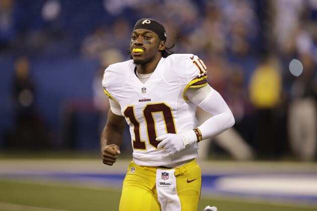 Washington Redskins quarterback Robert Griffin III takes the field for the second half of an NFL football game against the Indianapolis Colts Sunday, Nov. 30, 2014, in Indianapolis. (AP Photo/Darron Cummings)