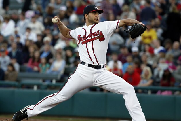 FILE - In this Feb. 28, 2014 file photo, Atlanta Braves starting pitcher Brandon Beachy throws in the first inning of a spring exhibition baseball game against the Houston Astros, in Kissimmee, Fla. Beachy will have ligament-replacement surgery in his right elbow for the second time and is expected to miss the entire season. The Braves said Thursday, March 20, 2014, that Dr. Neal ElAttrache will operate on Friday in Los Angeles. (AP Photo/Alex Brandon, File)