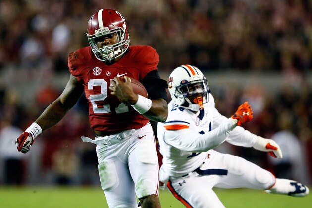 TUSCALOOSA, AL - NOVEMBER 29:  Derrick Henry #27 of the Alabama Crimson Tide runs the ball in the fourth quarter against the Auburn Tigers during the Iron Bowl at Bryant-Denny Stadium on November 29, 2014 in Tuscaloosa, Alabama.  (Photo by Kevin C. Cox/Getty Images)