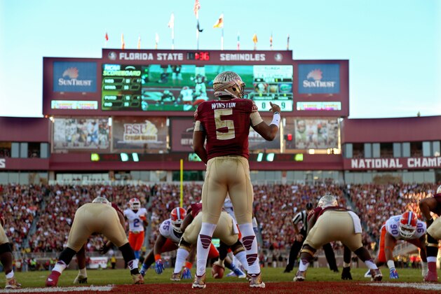 TALLAHASSEE, FL - NOVEMBER 29:  Jameis Winston #5 of the Florida State Seminoles looks turnover pass during  a game against the Florida Gators  at Doak Campbell Stadium on November 29, 2014 in Tallahassee, Florida.  (Photo by Mike Ehrmann/Getty Images)