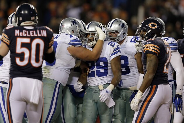 Dallas Cowboys running back DeMarco Murray (29) celebrates a touchdown with his teammates during the first half of an NFL football game against the Chicago Bears Thursday, Dec. 4, 2014, in Chicago. (AP Photo/Nam Y. Huh)
