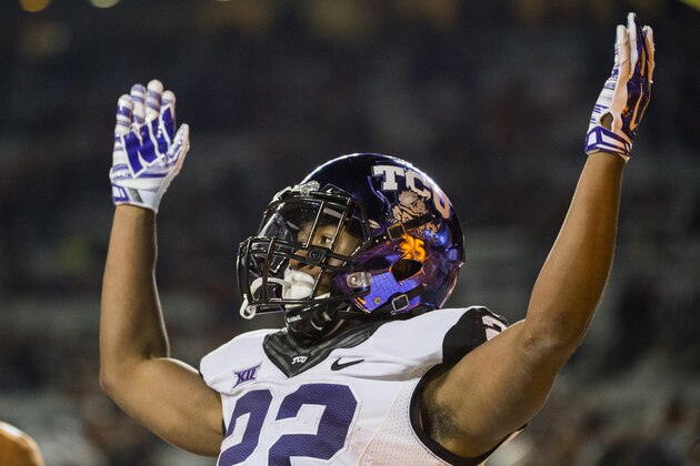 TCU's Aaron Green (22) celebrates a touchdown during the second half of an NCAA college football game against Texas, Thursday, Nov. 27, 2014, in Austin, Texas. (AP Photo/Ashley Landis)
