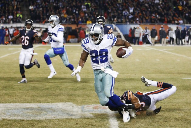 CHICAGO, IL - DECEMBER 4: Brock Vereen #45 of the Chicago Bears tackles DeMarco Murray #29 of the Dallas Cowboys to save a touchdown run during the third quarter of a game at Soldier Field on December 4, 2014 in Chicago, Illinois. (Photo by Joe Robbins/Getty Images)  CHICAGO, IL - DECEMBER 4: Tony Romo #9 of the Dallas Cowboys during warmups before a game against the Chicago Bears at Soldier Field on December 4, 2014 in Chicago, Illinois. (Photo by Joe Robbins/Getty Images)