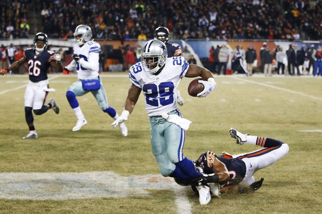 CHICAGO, IL - DECEMBER 4: Brock Vereen #45 of the Chicago Bears tackles DeMarco Murray #29 of the Dallas Cowboys to save a touchdown run during the third quarter of a game at Soldier Field on December 4, 2014 in Chicago, Illinois. (Photo by Joe Robbins/Getty Images)  CHICAGO, IL - DECEMBER 4: Tony Romo #9 of the Dallas Cowboys during warmups before a game against the Chicago Bears at Soldier Field on December 4, 2014 in Chicago, Illinois. (Photo by Joe Robbins/Getty Images)