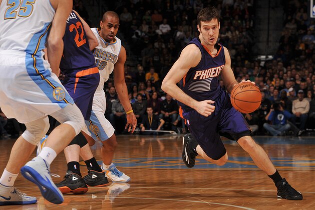 DENVER, CO - NOVEMBER 28:  Goran Dragic #1 of the Phoenix Suns handles the ball against the Denver Nuggets during the game on November 28, 2014 at the Pepsi Center in Denver, Colorado. NOTE TO USER: User expressly acknowledges and agrees that, by downloading and/or using this Photograph, user is consenting to the terms and conditions of the Getty Images License Agreement. Mandatory Copyright Notice: Copyright 2014 NBAE (Photo by Bart Young/NBAE via Getty Images)