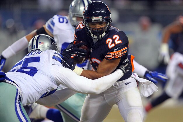 Dec 4, 2014; Chicago, IL, USA; Chicago Bears running back Matt Forte (22) is tackled by Dallas Cowboys middle linebacker Rolando McClain (55) during the second half at Soldier Field. Dallas won 41-28. Mandatory Credit: Dennis Wierzbicki-USA TODAY Sports