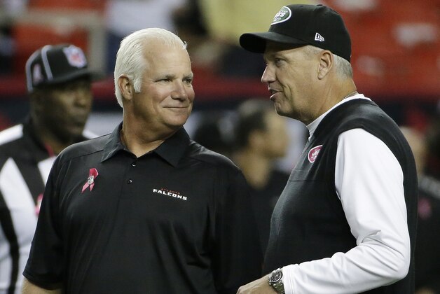 Atlanta Falcons head coach Mike Smith, left, speaks with New York Jets head coach Rex Ryan before the first half of an NFL football game, Monday, Oct. 7, 2013, in Atlanta. (AP Photo/David Goldman)