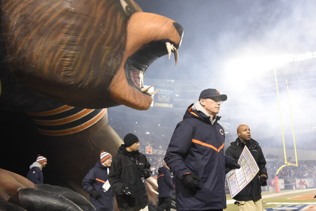 CHICAGO, IL - DECEMBER 04: Head coach Marc Trestman of the Chicago Bears takes the field with his team against the Dallas Cowboys on December 4, 2014 at Soldier Field in Chicago, Illinois.  The Dallas Cowboys defeated the Chicago Bears 41-28.  (Photo by David Banks/Getty Images)