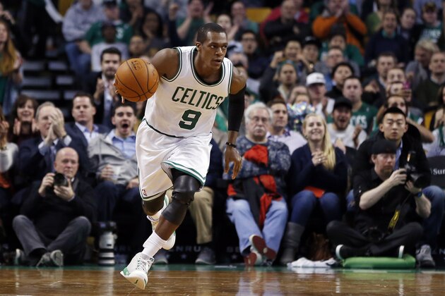 Boston Celtics guard Rajon Rondo (9) dribbles the ball up court during the second half of an NBA basketball game against the Detroit Pistons in Boston, Wednesday, Dec. 3, 2014. (AP Photo/Elise Amendola)