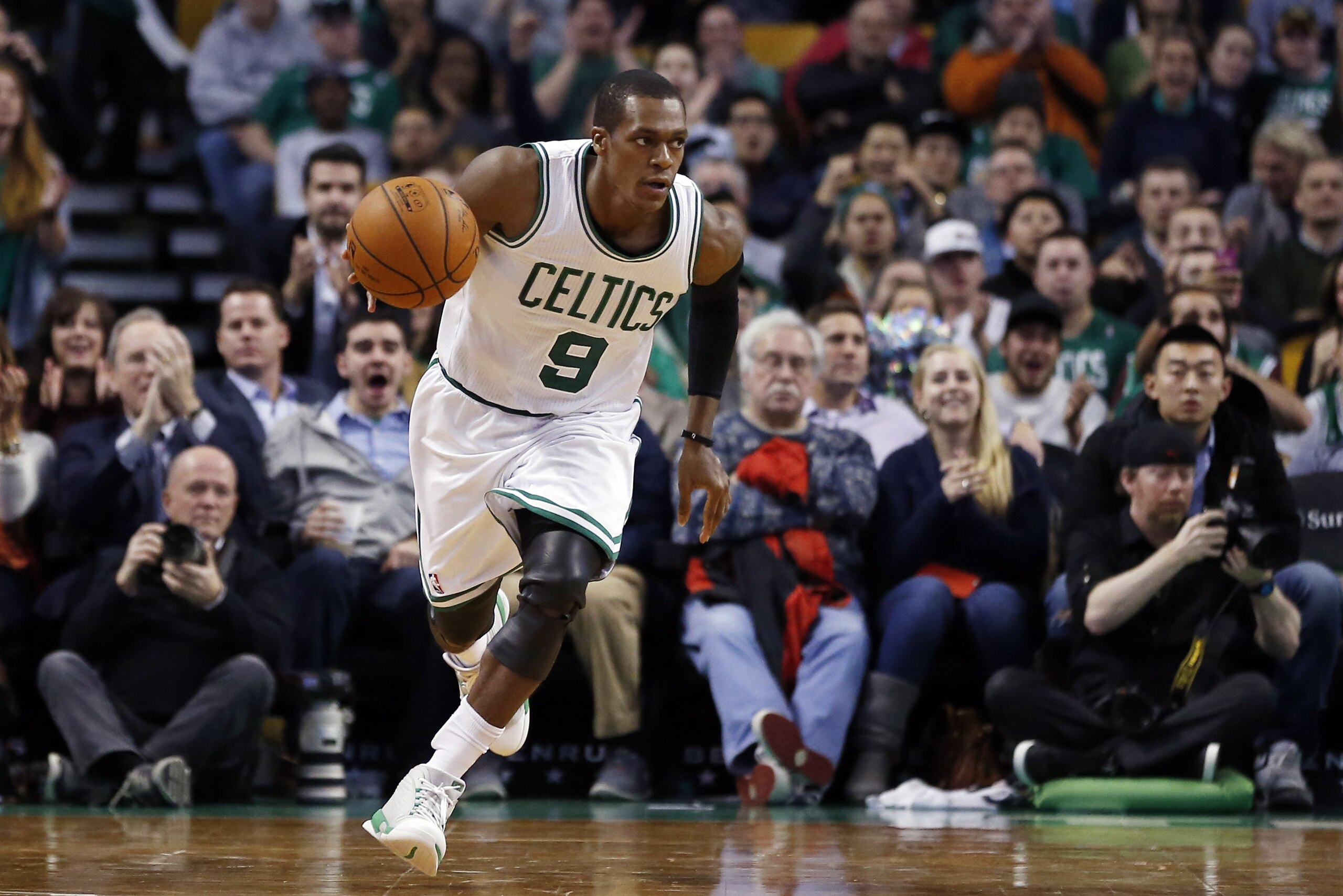 Boston Celtics guard Rajon Rondo (9) dribbles the ball up court during the second half of an NBA basketball game against the Detroit Pistons in Boston, Wednesday, Dec. 3, 2014. (AP Photo/Elise Amendola)