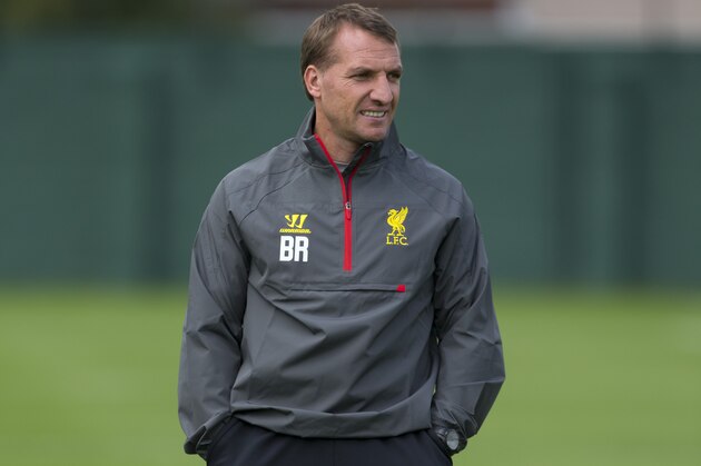 Liverpool's manager Brendan Rodgers watches his players train at Melwood training ground, in Liverpool, Monday, Sept. 15, 2014. Liverpool will play Ludogorets in a Champion's League Group B soccer match on Tuesday. (AP Photo/Jon Super)