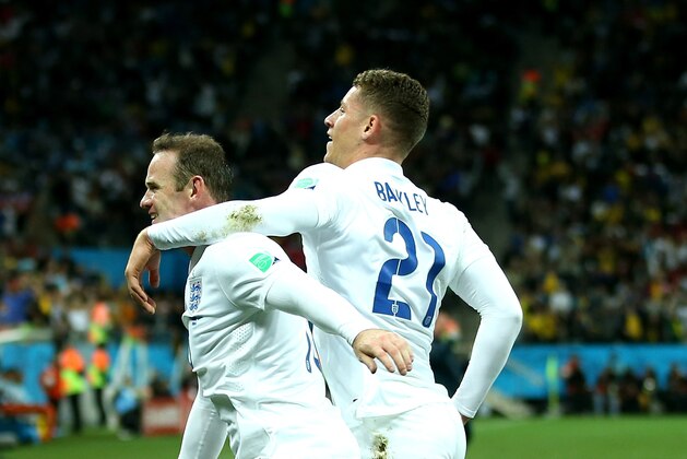 SAO PAULO, BRAZIL - JUNE 19:  Wayne Rooney celebrates scoring his team's first goal with Ross Barkley  during the 2014 FIFA World Cup Brazil Group D match between Uruguay and England at Arena de Sao Paulo on June 19, 2014 in Sao Paulo, Brazil.  (Photo by Richard Heathcote/Getty Images)