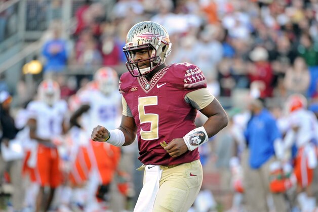 Nov 29, 2014; Tallahassee, FL, USA; Florida State Seminoles quarterback Jameis Winston (5) comes off of the field after throwing an interception during the first half of the game against the Florida Gators at Doak Campbell Stadium. Mandatory Credit: Melina Vastola-USA TODAY Sports
