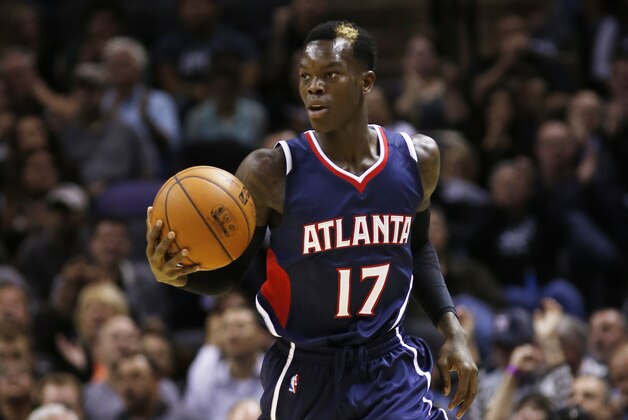 SAN ANTONIO, TX - NOVEMBER 5: Dennis Schroder #17 of the Atlanta Hawks brings the ball up court against the San Antonio Spurs at the AT&T Center on November 5, 2014 in San Antonio, Texas. NOTE TO USER: User expressly acknowledges and agrees that, by downloading to the terms and conditions of the Getty Images License Agreement. (Photo by Chris Covatta/Getty Images)