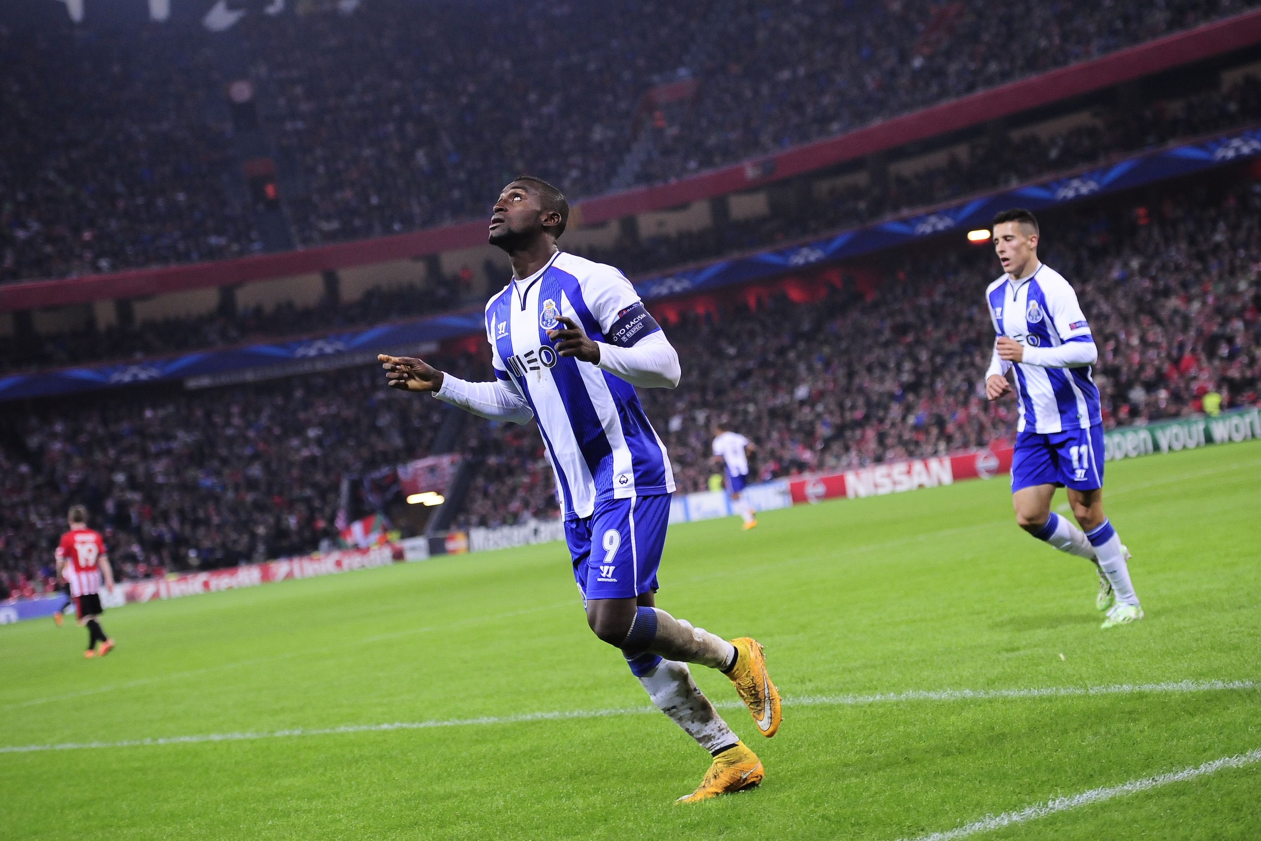 FC Porto Jackson Martinez, left, celebrates his goal after scoring during the Champions League Group H soccer match between Athletic Bilbao and FC Porto, at San Mames stadium, in Bilbao, northern Spain, Wednesday, Nov.5, 2014. (AP Photo/Alvaro Barrientos)
