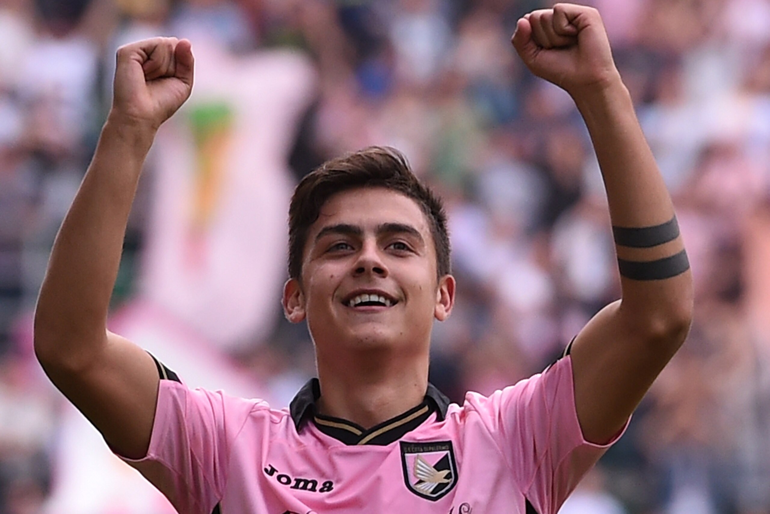 PALERMO, ITALY - NOVEMBER 30:Paulo Dybala of Palermo celebrates after scoring the opening goal during the Serie A match between US Citta di Palermo and Parma FC at Stadio Renzo Barbera on November 30, 2014 in Palermo, Italy.  (Photo by Tullio M. Puglia/Getty Images)
