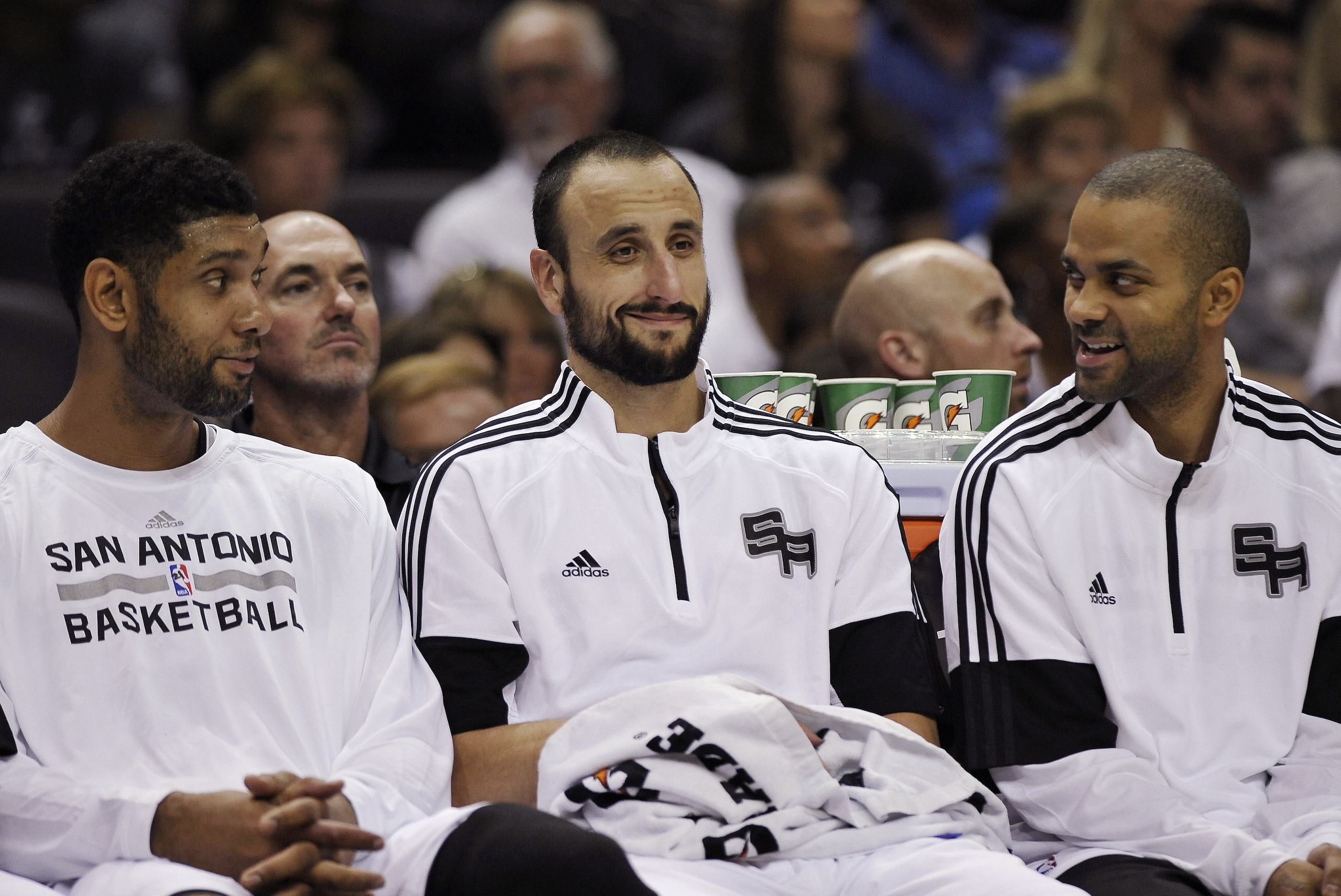 San Antonio Spurs' Tim Duncan; Manu Ginobili, of Argentina; and Tony Parker, of France, talk on the bench during the first half of a preseason NBA basketball game against the Miami Heat, Saturday, Oct. 18, 2014, in San Antonio. Miami won 111-108 in overtime. (AP Photo/Darren Abate) San Antonio Spurs' Tim Duncan; Manu Ginobili, of Argentina; and Tony Parker, of France, talk on the bench during the first half of a preseason NBA basketball game against the Miami Heat, Saturday, Oct. 18, 2014, in San Antonio. Miami won 111-108 in overtime. (AP Photo/Darren Abate)