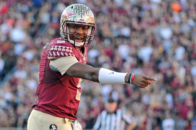 Nov 29, 2014; Tallahassee, FL, USA; Florida State Seminoles quarterback Jameis Winston (5) signals directions to his teammates during the first half of the game against the Florida Gators at Doak Campbell Stadium. Mandatory Credit: Melina Vastola-USA TODAY Sports
