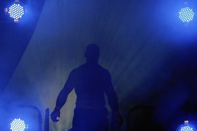 LONDON - FEBRUARY 10: Deathwish Dave Legeno walks out into the arena during the Cage Rage Championship 20 Born to fight event at Wembley Arena on February 10, 2007 in London, England. Cage Fighting also known as MMA Mixed Martial Arts is a mixed fighting style combat sport with a steadily growing international fan base. MMA is an evolving combat sport where competitors combine different disciplines that include jiu-jitsu, judo, karate, boxing, kickboxing, wrestling and others to their strategic and tactical advantage in a competetive arena.  (Photo by Daniel Berehulak/Getty Images)