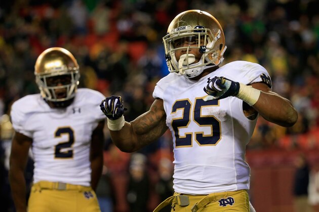 LANDOVER, MD - NOVEMBER 01:  Running back Tarean Folston #25 of the Notre Dame Fighting Irish celebrates after rushing for a fourth quarter touchdown against the Navy Midshipmen at FedExField on November 1, 2014 in Landover, Maryland.  (Photo by Rob Carr/Getty Images)