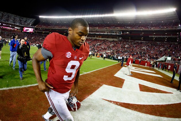 TUSCALOOSA, AL - NOVEMBER 29: Amari Cooper #9 of the Alabama Crimson Tide celebrates as he runs off the field after defeating the Auburn Tigers in the Iron Bowl at Bryant-Denny Stadium on November 29, 2014 in Tuscaloosa, Alabama. The Alabama Crimson Tide defeated the Auburn Tigers 55 to 44.  (Photo by Kevin C. Cox/Getty Images)