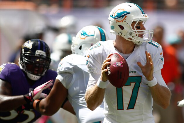 Oct 6, 2013; Miami Gardens, FL, USA; Miami Dolphins quarterback Ryan Tannehill (17) drops back to pass in the first quarter of a game against the Baltimore Ravens at Sun Life Stadium. Mandatory Credit: Robert Mayer-USA TODAY Sports
