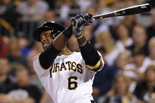 Pittsburgh Pirates' Starling Marte (6) hits a solo home run off Boston Red Sox starting pitcher Brandon Workman during the fifth inning of a baseball game in Pittsburgh Thursday, Sept. 18, 2014. (AP Photo/Gene J. Puskar)