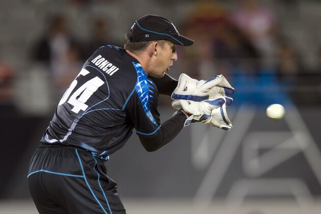 New Zealand’s wicket keeper Luke Ronchi catches the ball as he plays against West Indies during the Twenty-20 International Cricket Match at Eden Park in Auckland, New Zealand, Saturday, Jan. 11, 2014. (AP Photo/SNPA, David Rowland) NEW ZEALAND OUT
