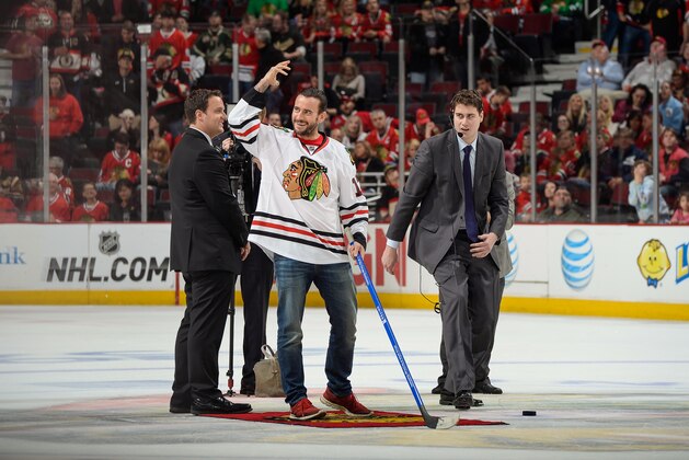 CHICAGO, IL - MAY 4: Professional wrestler CM Punk addresses the crowd before taking his shot in between periods of Game Two of the Second Round of the 2014 Stanley Cup Playoffs between the Minnesota Wild and the Chicago Blackhawks at the United Center on May 04, 2014 in Chicago, Illinois. (Photo by Bill Smith/NHLI via Getty Images)
