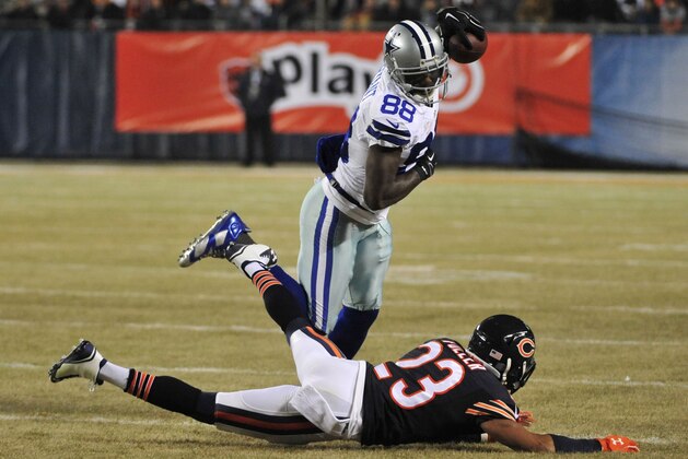 CHICAGO, IL - DECEMBER 4: Dez Bryant #88 of the Dallas Cowboys is tripped up by Kyle Fuller #23 of the Chicago Bears during the first quarter of a game at Soldier Field on December 4, 2014 in Chicago, Illinois. (Photo by David Banks/Getty Images)