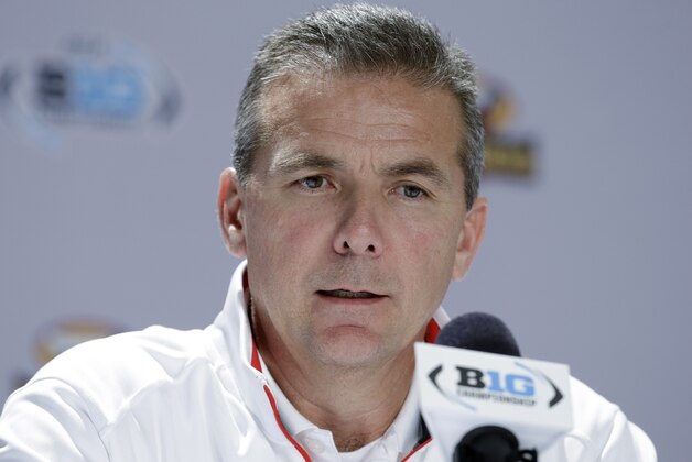 Ohio State head coach Urban Meyer responds to a question during a news conference for the Big Ten Conference championship NCAA college football game Friday, Dec. 5, 2014, in Indianapolis. Ohio State will play Wisconsin on  Saturday for the championship. (AP Photo/Darron Cummings)