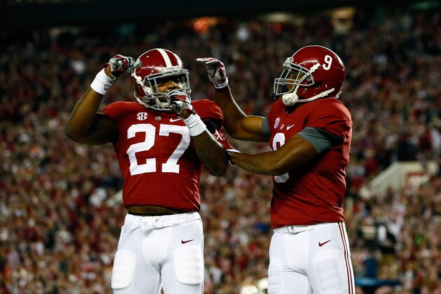 TUSCALOOSA, AL - NOVEMBER 29:  Amari Cooper #9 of the Alabama Crimson Tide celebrates with Derrick Henry #27 after catching a 39 yard touchdown pass thrown by Blake Sims #6 in the third quarter against the Auburn Tigers during the Iron Bowl at Bryant-Denny Stadium on November 29, 2014 in Tuscaloosa, Alabama.  (Photo by Kevin C. Cox/Getty Images)