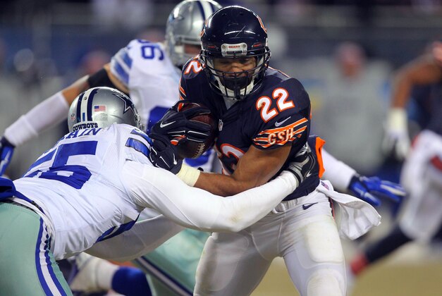 Dec 4, 2014; Chicago, IL, USA; Chicago Bears running back Matt Forte (22) is tackled by Dallas Cowboys middle linebacker Rolando McClain (55) during the second half at Soldier Field. Dallas won 41-28. Mandatory Credit: Dennis Wierzbicki-USA TODAY Sports