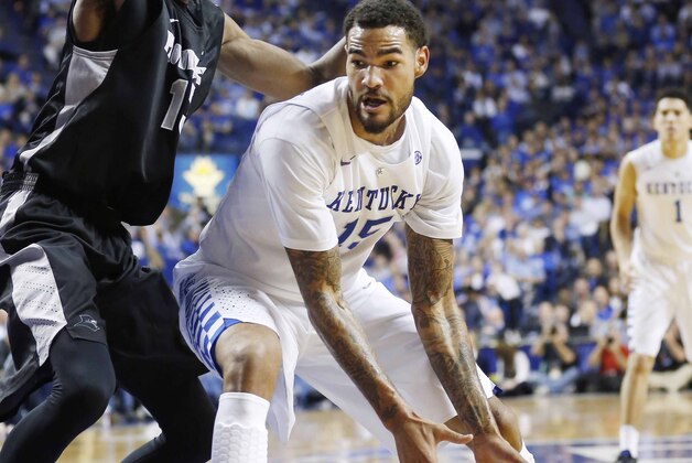 Nov 30, 2014; Lexington, KY, USA; Kentucky Wildcats forward Willie Cauley-Stein (15) dribbles the ball against Providence Friars center Paschal Chukwu (13) during the second half at Rupp Arena. Kentucky defeated Providence 58-38. Mandatory Credit: Mark Zerof-USA TODAY Sports