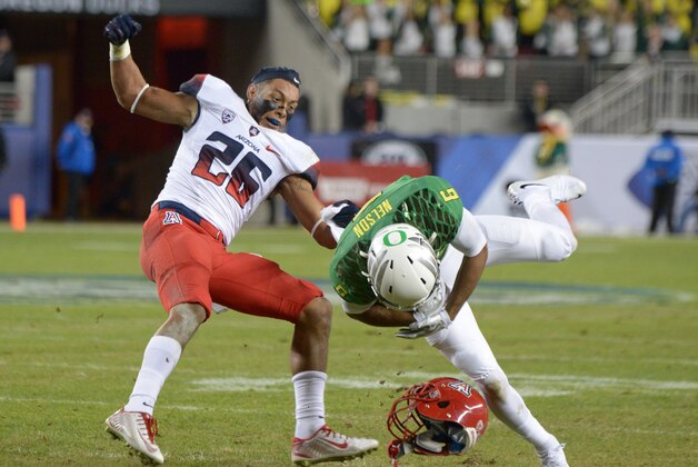 Dec 5, 2014; Santa Clara, CA, USA; Oregon Ducks receiver Charles Nelson (6) is tackled by Arizona Wildcats safety Jourdon Grandon (26) in the Pac-12 Championship at Levi's Stadium. Mandatory Credit: Kirby Lee-USA TODAY Sports